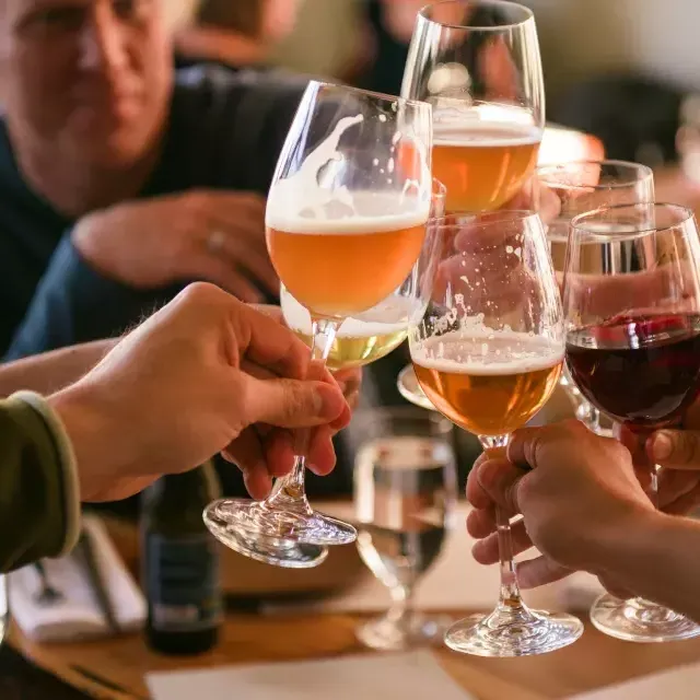 A group of travelers share a drink at a San Francisco bar.